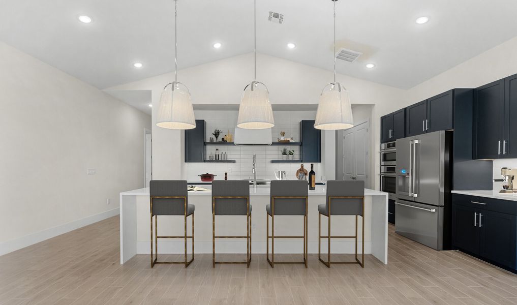 Kitchen with pendant lighting and waterfall edge island