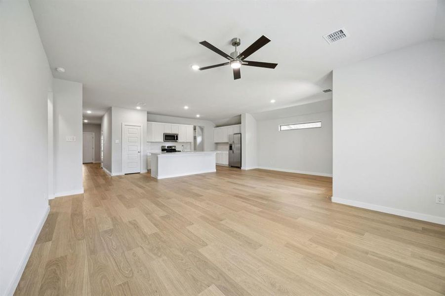 First Floor in the Heisman home plan by Trophy Signature Homes – REPRESENTATIVE PHOTO First Floor in the Heisman home plan by Trophy Signature Homes – REPRESENTATIVE PHOTO