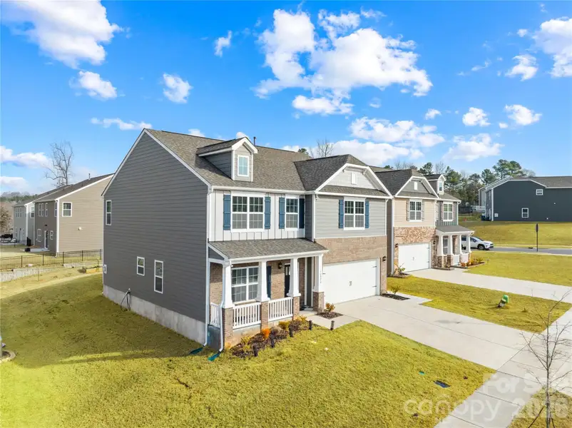 Front exterior of a new home in Adair Woods, Davidson, NC, highlighting curb appeal (Image 2). Front exterior of a new home in Adair Woods, Davidson, NC, highlighting curb appeal (Image 2).