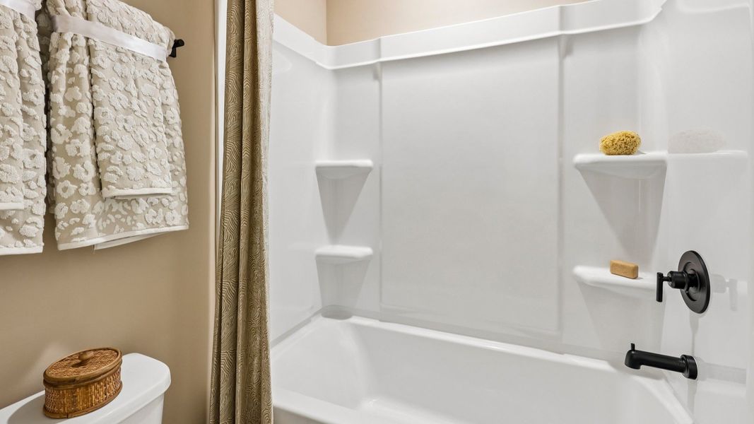 Secondary bathroom with shower and toilet Secondary bathroom with shower and toilet