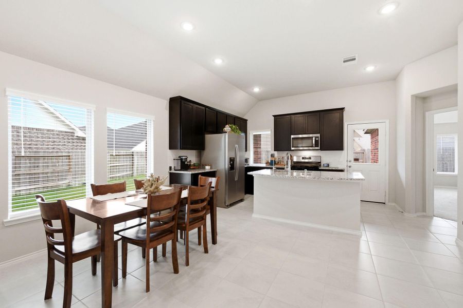 Open kitchen over looking the dining room and living area.