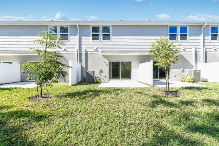 Exterior details and patio area of a home in Vinterra Townhomes, Nokomis (Image 2).