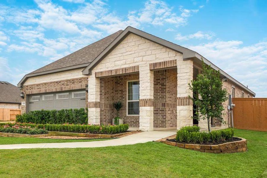 Front exterior of a new home in Sunterra, Katy, TX, highlighting curb appeal (Image 1). Front exterior of a new home in Sunterra, Katy, TX, highlighting curb appeal (Image 1).