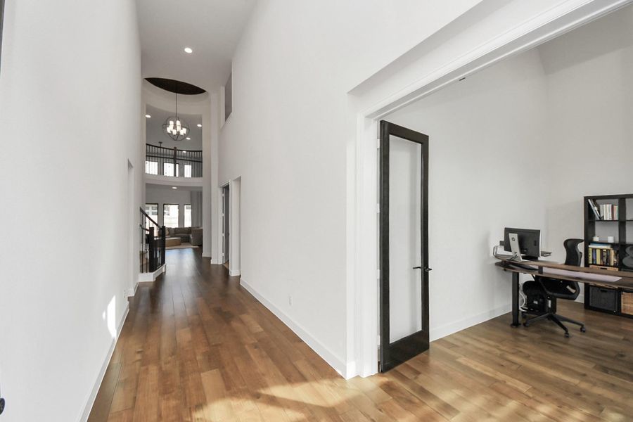 Long, open hallway with high ceilings and modern finishes.