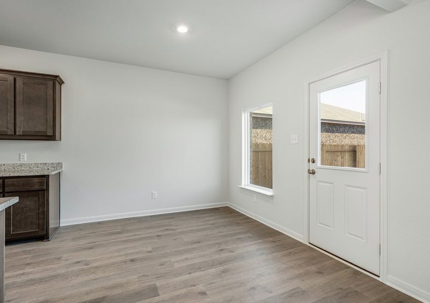 The dining room has a large window that lets in great, natural light.