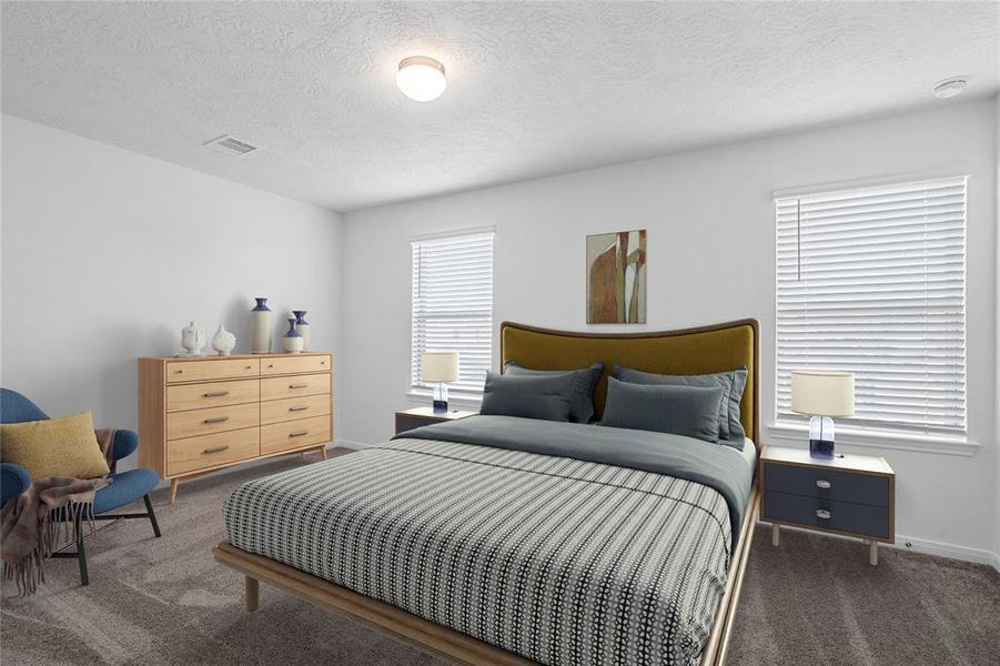 Secondary bedroom features plush carpet, custom paint, lighting, ample closet space, and a large window with privacy blinds.