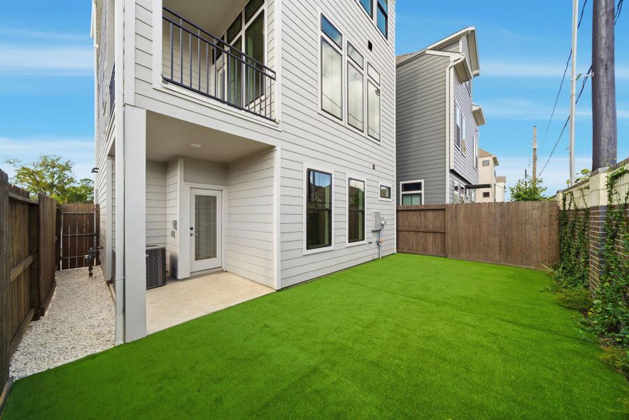 Exterior details and patio area of a home in Spring Valley Creek, Houston (Image 3).