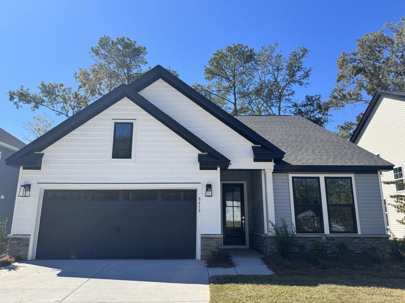 Front exterior of a new home in Indigo Place, North Charleston, SC, highlighting curb appeal (Image 9). Front exterior of a new home in Indigo Place, North Charleston, SC, highlighting curb appeal (Image 9).