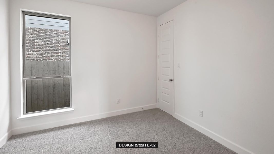 Spare room featuring baseboards and carpet flooring