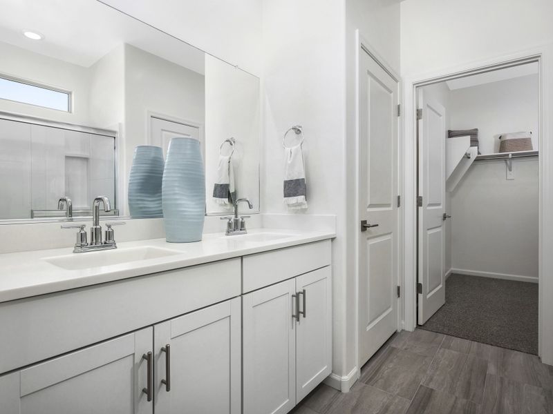 The primary bathroom features a walk-in closet, walk-in shower and linen closet.