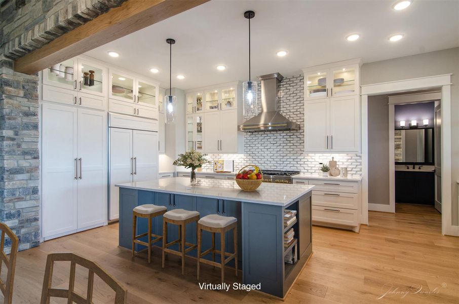 notice the closed pantry doors next to the built in refrigerator. The hidden pantry is easy to miss. notice the closed pantry doors next to the built in refrigerator. The hidden pantry is easy to miss.