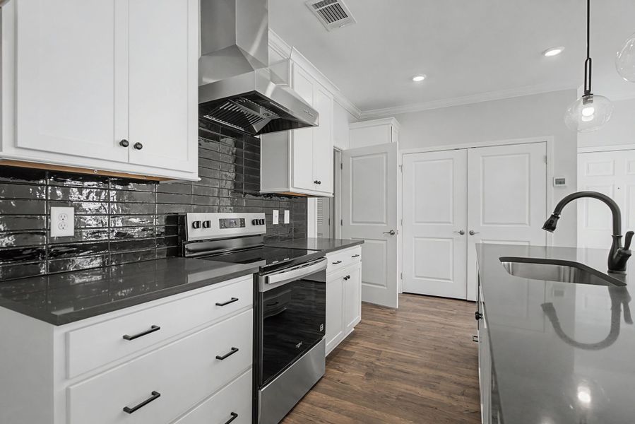 Carothers Farms Town Center Homes (Condos) Kitchen with Range and Farm Sink