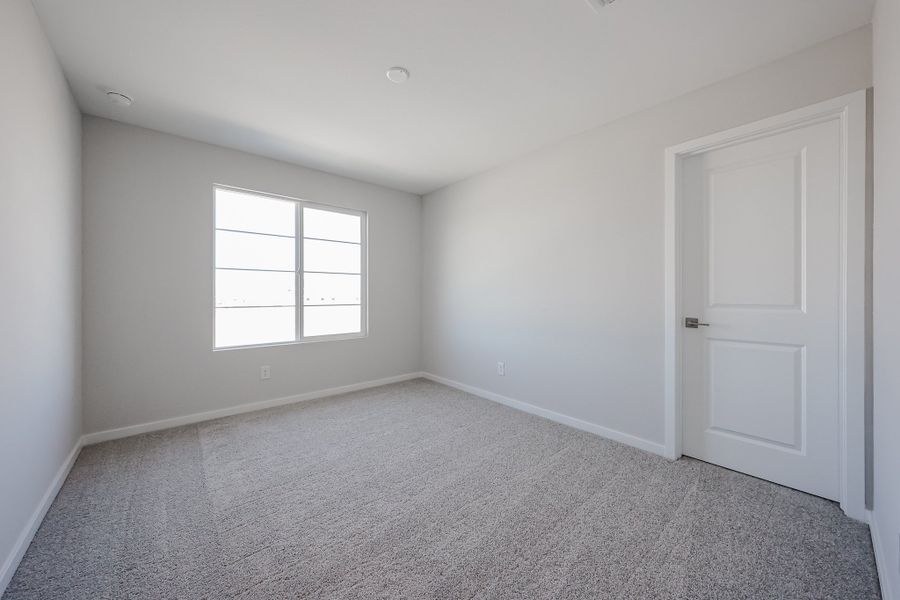 A room with a door and a window.