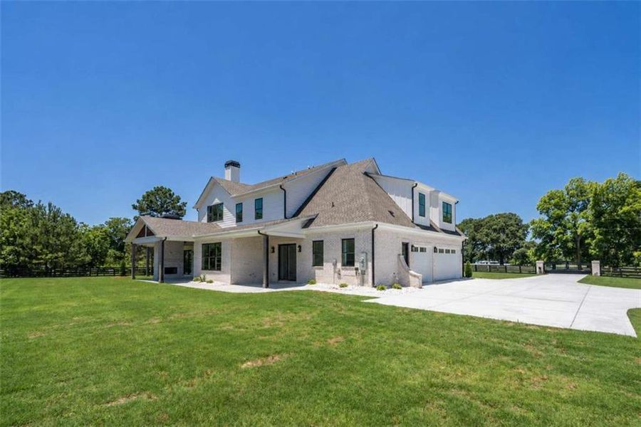 Front exterior of a new home in , Monroe, GA, highlighting curb appeal (Image 28). Front exterior of a new home in , Monroe, GA, highlighting curb appeal (Image 28).