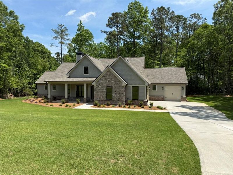 Front exterior of a new home in , Monroe, GA, highlighting curb appeal (Image 10).