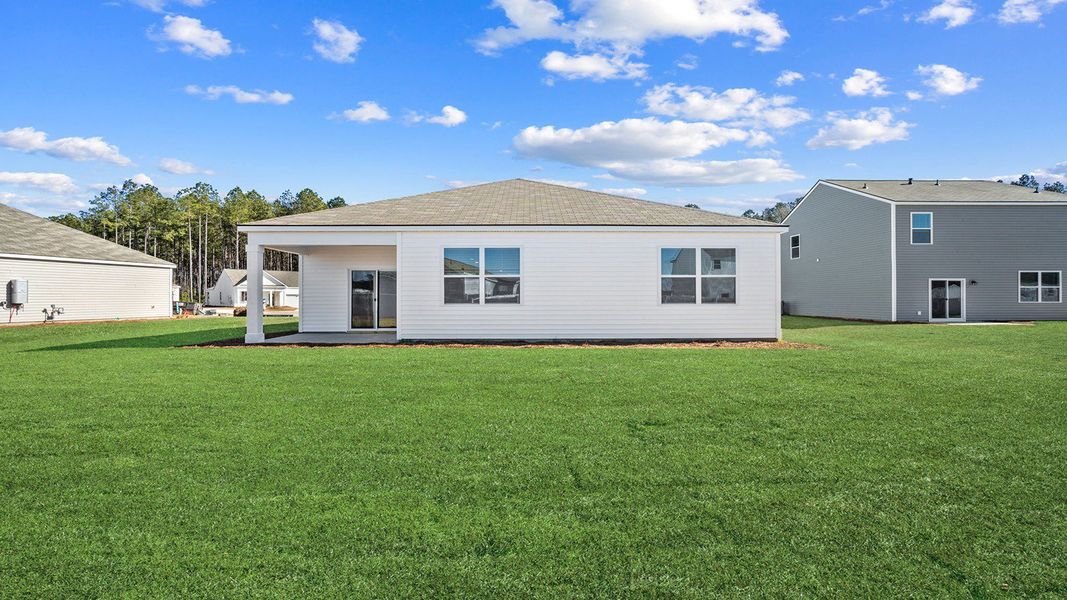 Exterior details and patio area of a home in The Groves at Bees Creek, Ridgeland (Image 3).