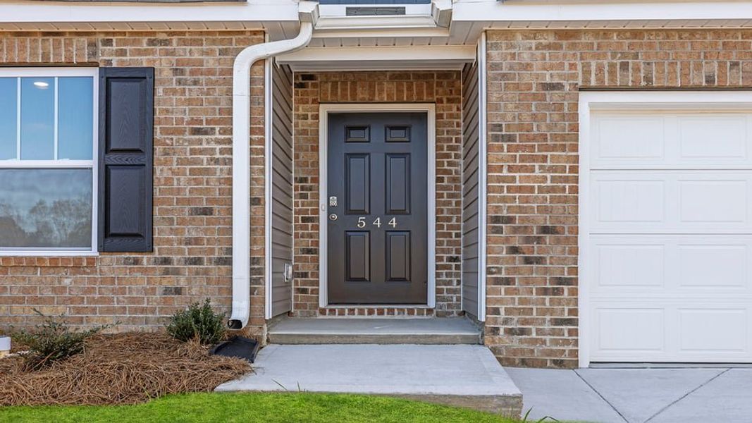 Exterior details and patio area of a home in Lakestone, Woodruff (Image 2).