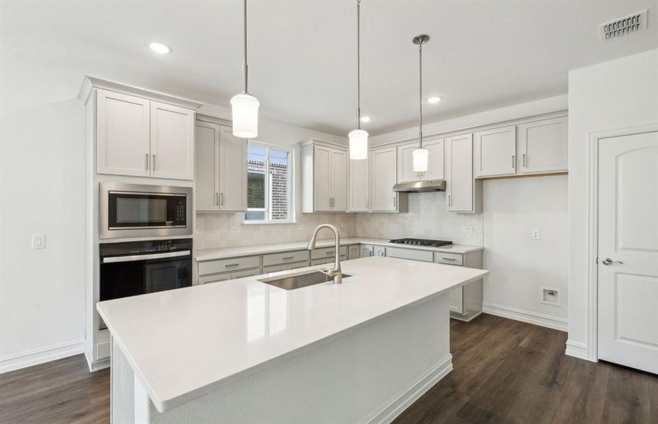 Bright kitchen with ample cabinet space *real home pictured