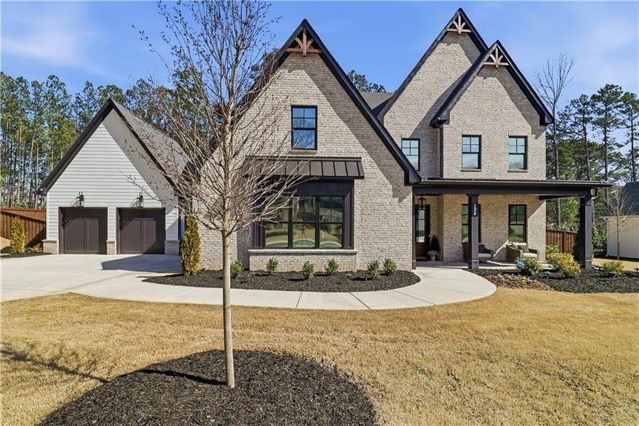Front exterior of a new home in , Woodstock, GA, highlighting curb appeal (Image 23).