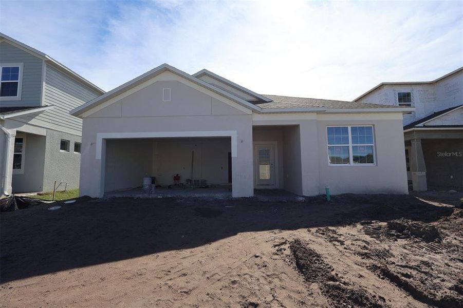 In-progress construction of a new home in Eden at Crossprairie, St. Cloud, FL (Image 8).