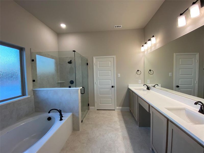 Large & bright master bathroom with quartz dual vanity & 12x24 oversized tile Large & bright master bathroom with quartz dual vanity & 12x24 oversized tile