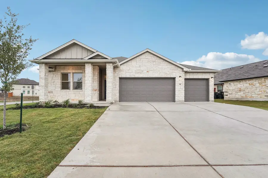 Front exterior of a new home in Crosswinds, Kyle, TX, highlighting curb appeal (Image 1). Front exterior of a new home in Crosswinds, Kyle, TX, highlighting curb appeal (Image 1).