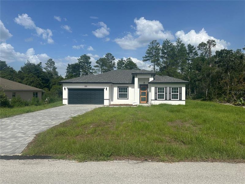 Front exterior of a new home in , Ocala, FL, highlighting curb appeal (Image 21).