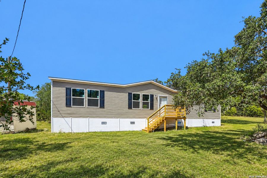 Exterior details and patio area of a home in , Hondo (Image 25).