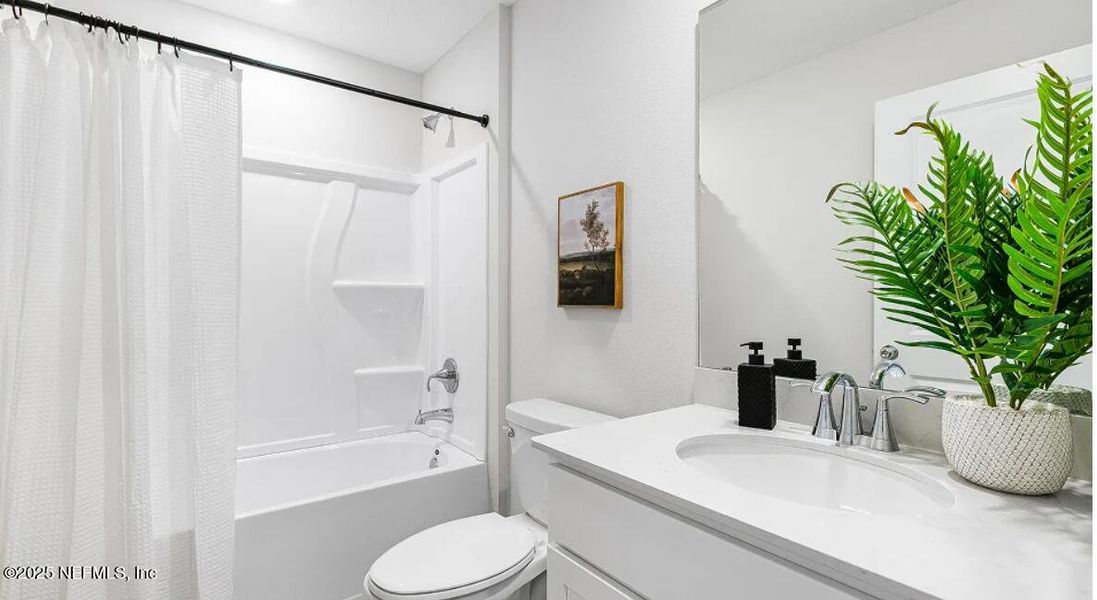 Furnished interior view inside a new home in Holstein Crossing: Holstein Crossing 50s, Green Cove Springs (Image 3). Furnished interior view inside a new home in Holstein Crossing: Holstein Crossing 50s, Green Cove Springs (Image 3).