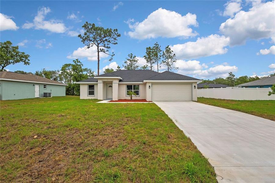 Front exterior of a new home in , Citrus Springs, FL, highlighting curb appeal (Image 2). Front exterior of a new home in , Citrus Springs, FL, highlighting curb appeal (Image 2).