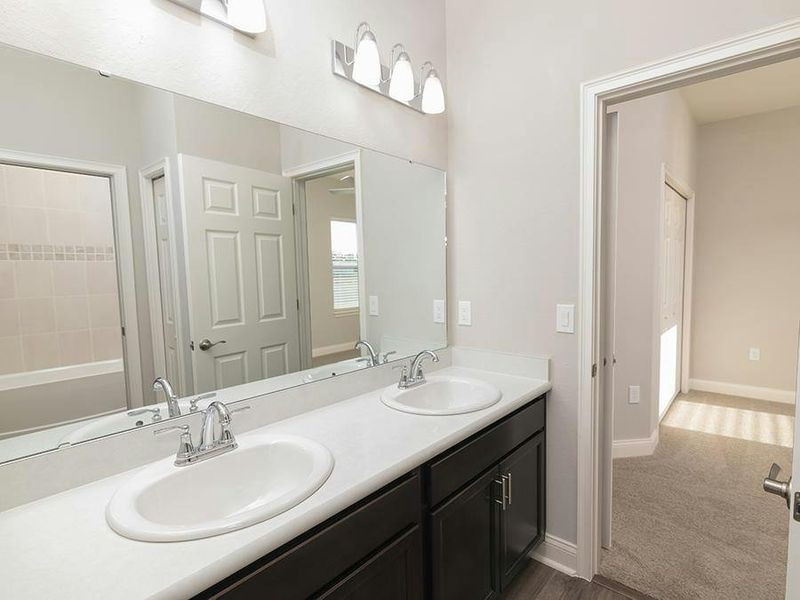 Bedrooms 2 and 3 share a Jack-and-Jill bath - Savannah by Highland Homes