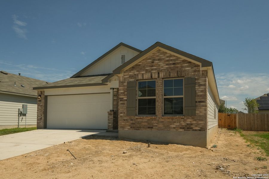 Front exterior of a new home in Blue Ridge Ranch, San Antonio, TX, highlighting curb appeal (Image 25). Front exterior of a new home in Blue Ridge Ranch, San Antonio, TX, highlighting curb appeal (Image 25).