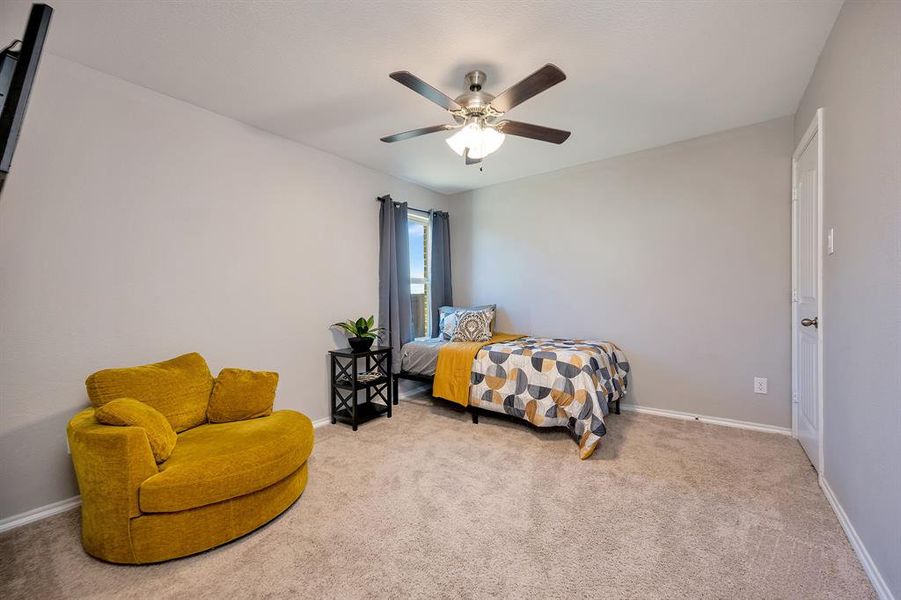 Bedroom with carpet floors and ceiling fan
