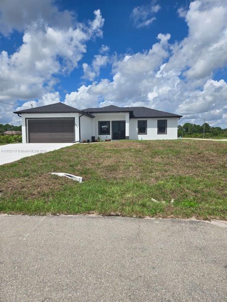 Front exterior of a new home in , Lehigh Acres, FL, highlighting curb appeal (Image 22). Front exterior of a new home in , Lehigh Acres, FL, highlighting curb appeal (Image 22).