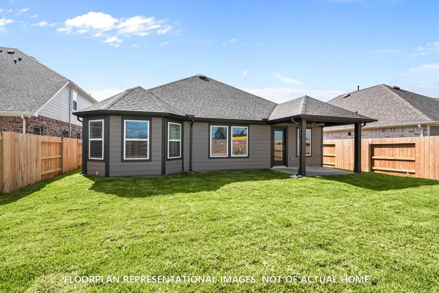 Front exterior of a new home in Ambrose, La Marque, TX, highlighting curb appeal (Image 1).