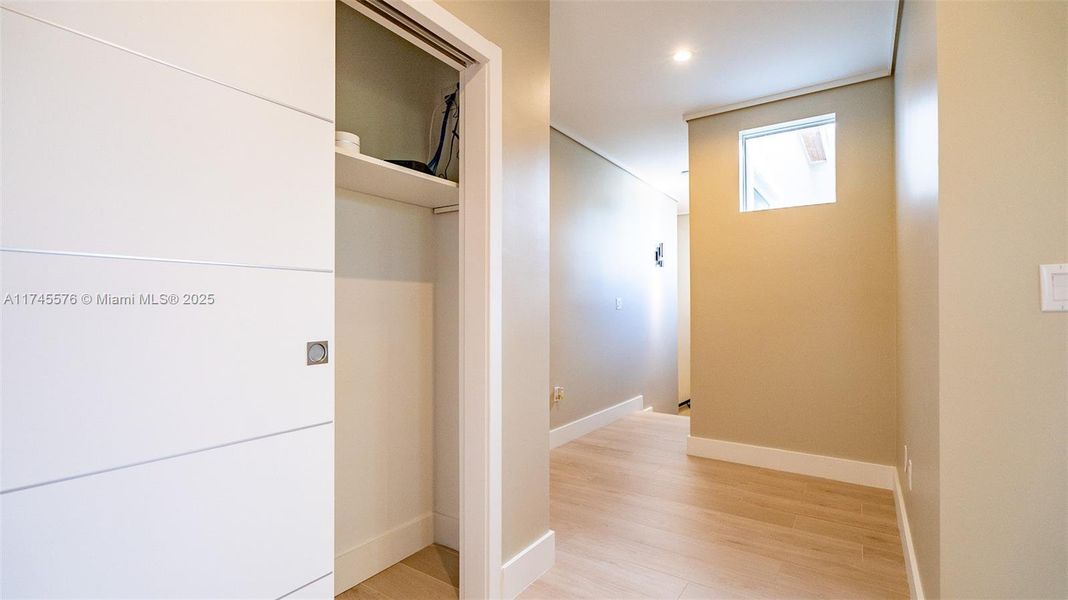 Hallway with closet