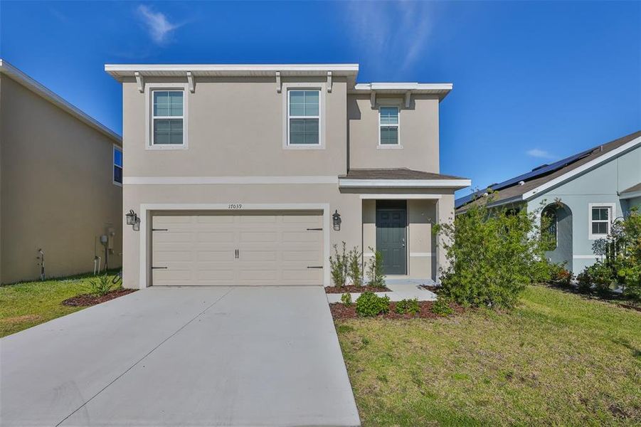 Front exterior of a new home in Southshore Bay, Wimauma, FL, highlighting curb appeal (Image 23). Front exterior of a new home in Southshore Bay, Wimauma, FL, highlighting curb appeal (Image 23).