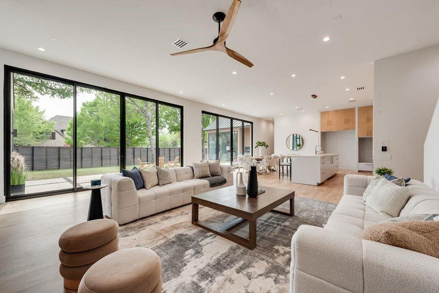 Expansive 10’ sliding glass doors create a seamless connection between indoor and outdoor living.