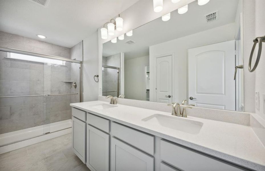 Owner's bathroom with dual vanity *real home pictured