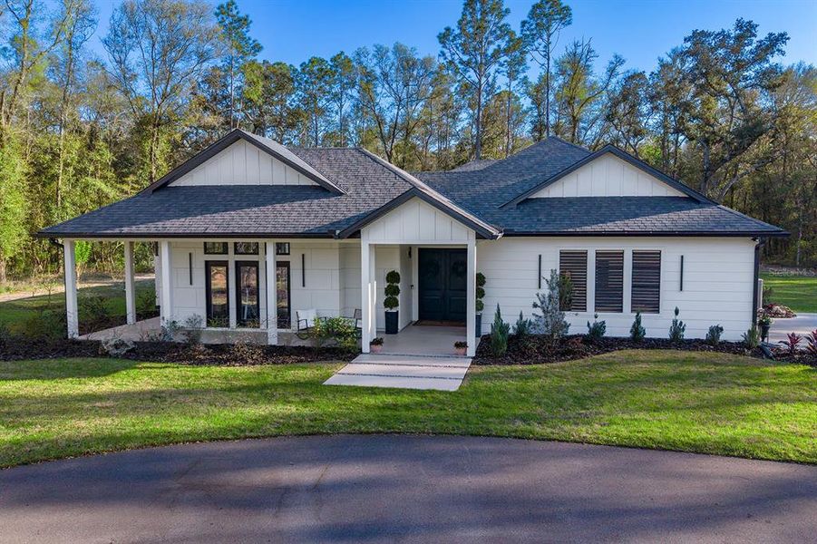 Front exterior of a new home in , High Springs, FL, highlighting curb appeal (Image 27).