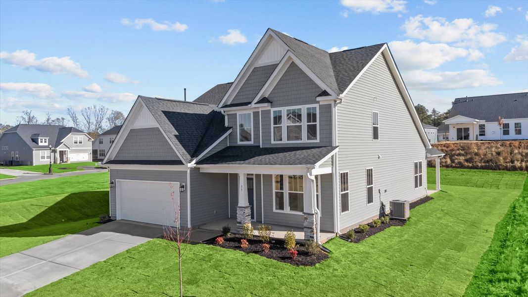 Front exterior of a new home in Woodglen, Piedmont, SC, highlighting curb appeal (Image 20).