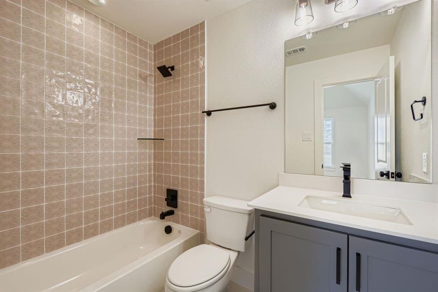 Bathroom with shower / bath combination and vanity Bathroom with shower / bath combination and vanity