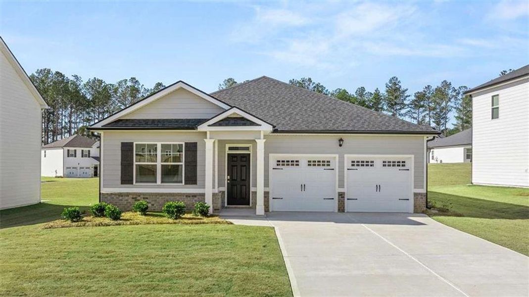 Front exterior of a new home in Oakchase at Hampton, Hampton, GA, highlighting curb appeal (Image 22).