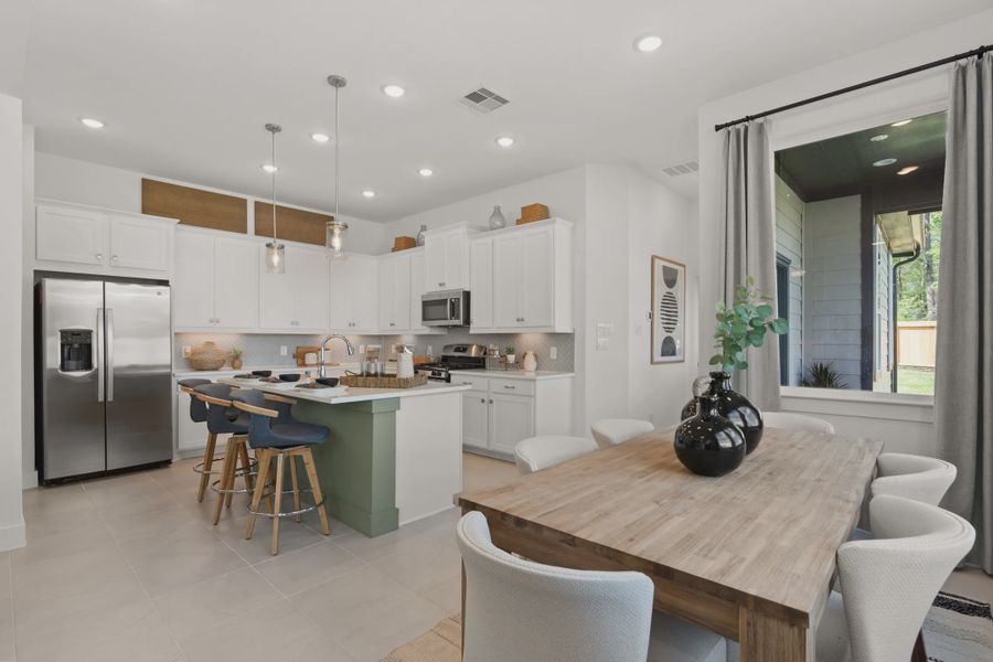 Representative furnished interior of a home built from the Versailles by Chesmar Homes in The Woodland Hills Chateau, Willis (Image 6).