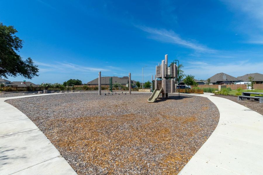 A modern, multi-level playground set is a perfect for burning off energy on a sunny afternoon.