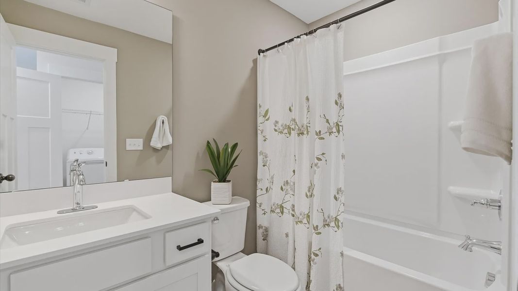 Churchill Design secondary bathroom with clean lines, contemporary lighting, and timeless style