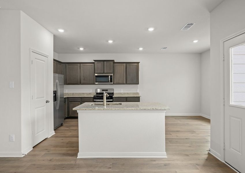 The kitchen has a convenient island. The kitchen has a convenient island.