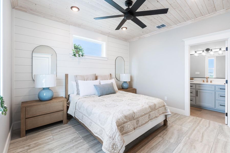 Bedroom featuring wood ceiling, ensuite bathroom, recessed lighting, light wood-style floors, and crown molding Bedroom featuring wood ceiling, ensuite bathroom, recessed lighting, light wood-style floors, and crown molding