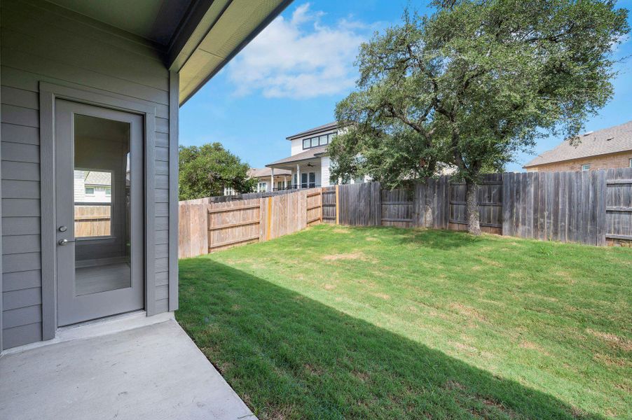 View of fenced backyard