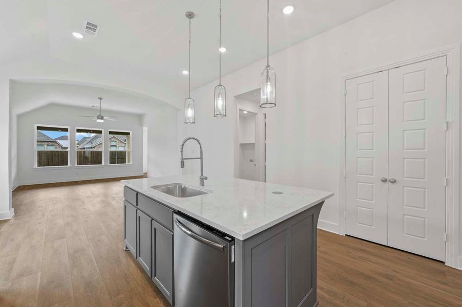 Kitchen with a ceiling fan, dishwasher, visible vents, a sink, and gray cabinets